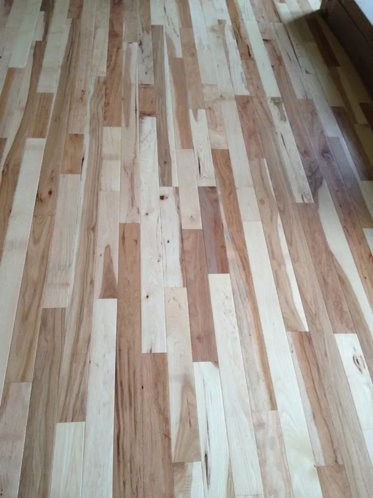 Natural wood flooring by Artistic Home Finishes.